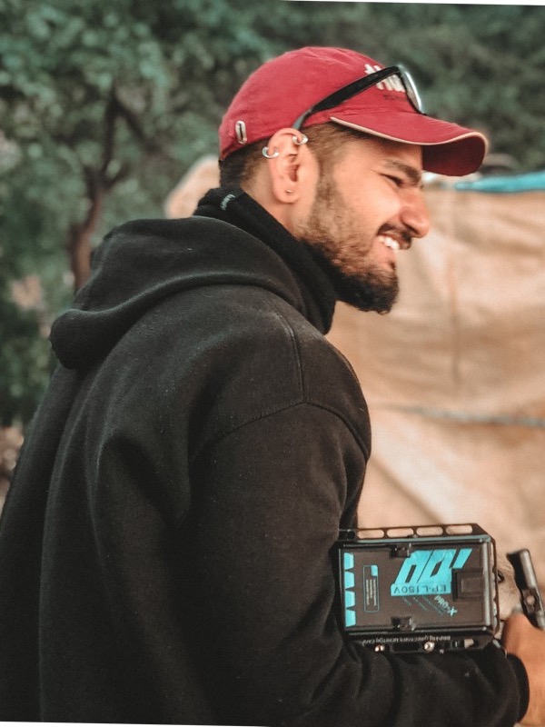 Ash, founder of By The Owl, on set